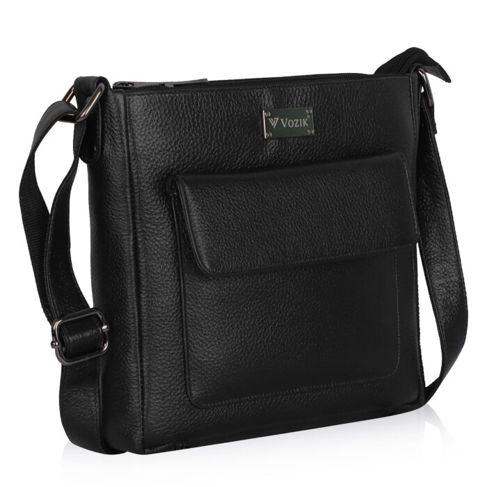 VOZIK Black Unisex Crossbody Bag - Angled view, highlighting the textured leather and adjustable strap with metal hardware.